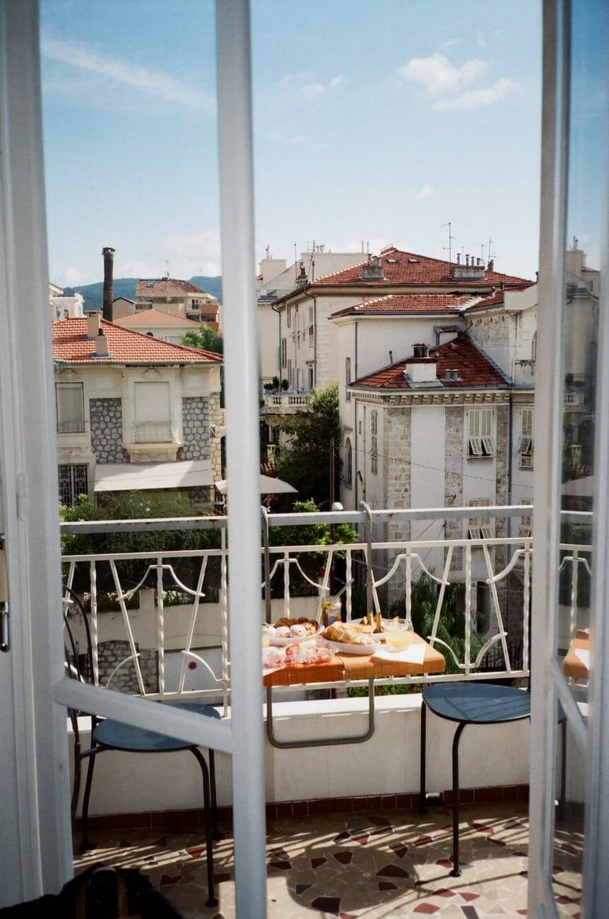 food and chairs in the balcony