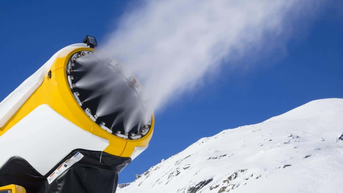 snow cannon snow gun is spraying artificial snow onto ski slope.jpg