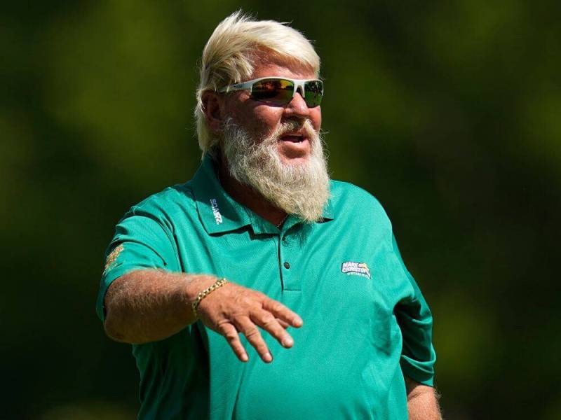 Golf: Watch – A barefoot John Daly hit a golf ball over an Ohio highway onto high school football field