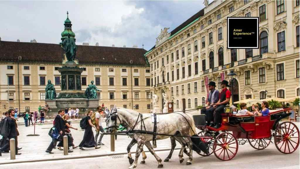 Hofburg: Hofburg Palace and traditional horse-drawn carriage in Vienna, Austria