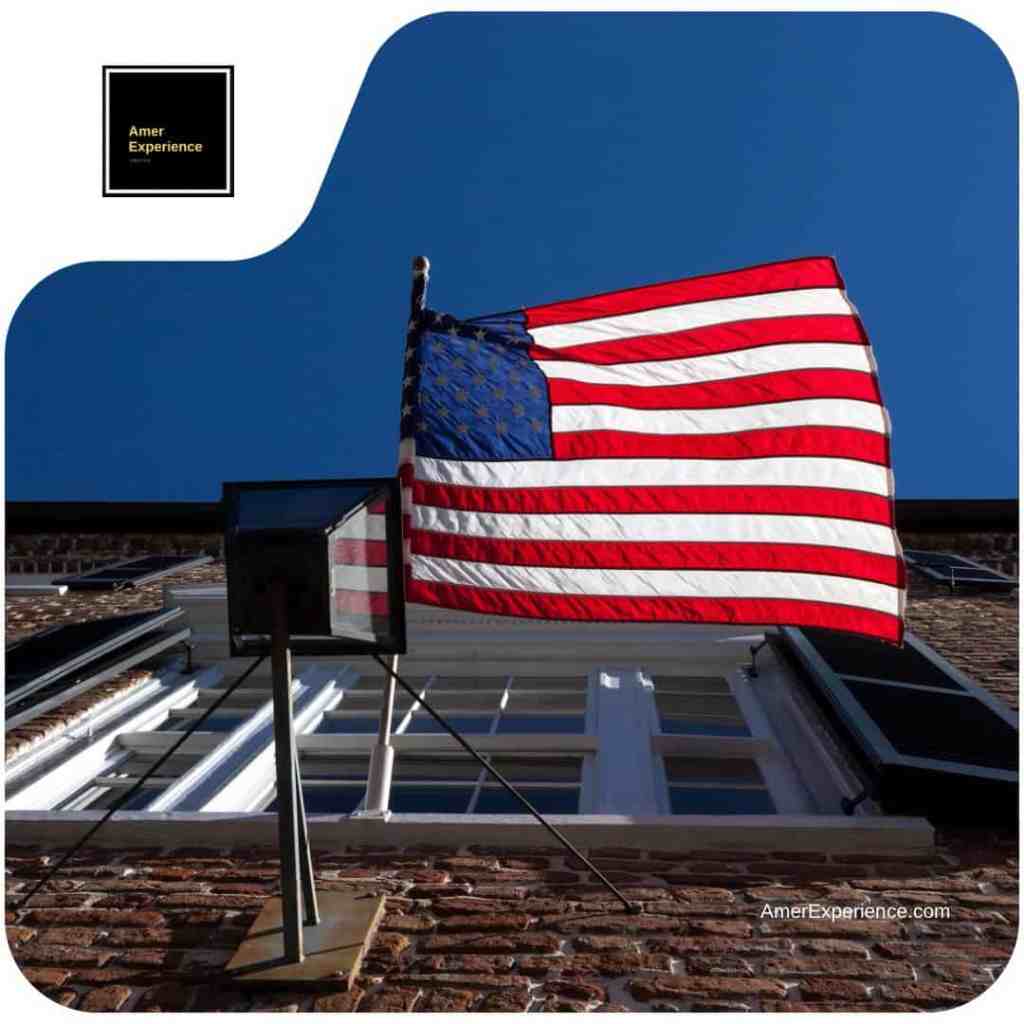 The American flag waving over a historic rooftop in downtown Charleston, South Carolina, showcasing the patriotic spirit of the South by AmerExperience by Lassi Pensikkala.
