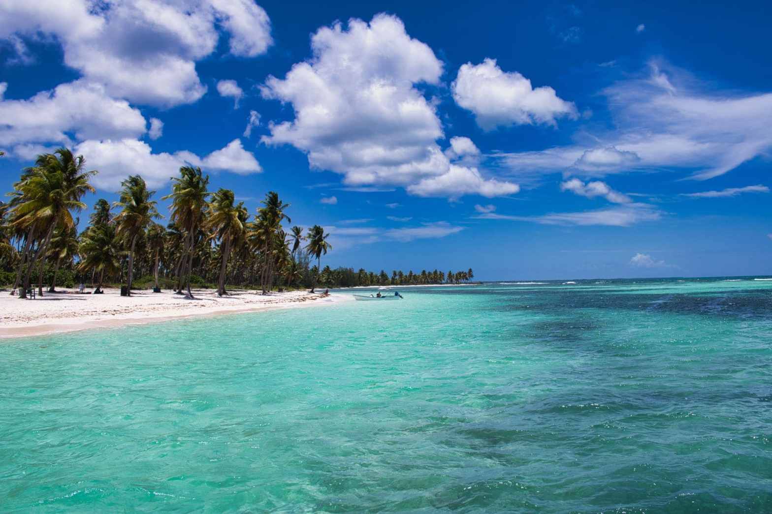 photo of sea under blue sky